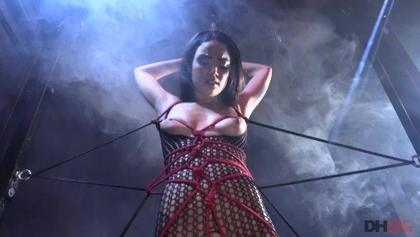 Busty brunette fucks while being roped and totally submissive on breastful.com