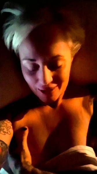 Busty blonde masturbates pussy in a close up photo on breastful.com