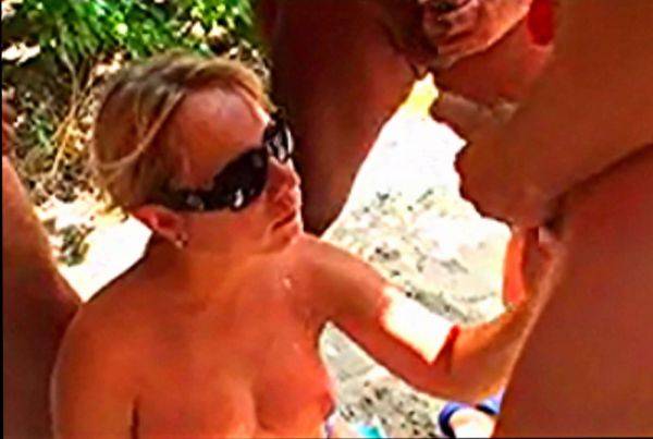 Wild bukkake gangbang for busty MILF on a beach on breastful.com