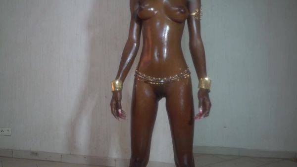 Oiled up busty ebony bitch plays with her pussy on breastful.com