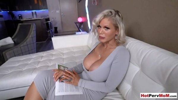 Busty blonde MILF stepmom gives handjob to stepson on breastful.com