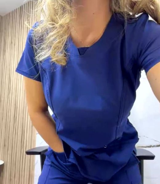 Busty Nurse Strips in Medical Office on breastful.com