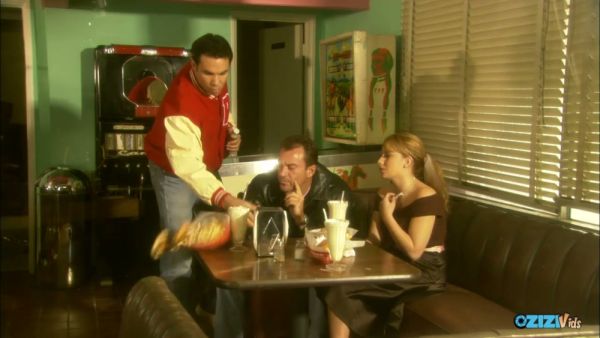 Dark-haired woman in stockings and heels takes on multiple men during her shift on breastful.com
