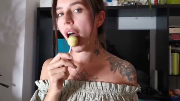 Tattooed brunette gives oral while holding a lollipop in POV shot on breastful.com