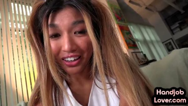 Asian cheerleader in purple skirt gives a passionate POV blowjob in the living room on breastful.com