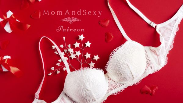 Voluptuous MILF teases in red lace lingerie with garters and stockings on breastful.com