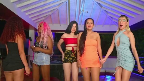 Redhead and ebony girls share a strapon in a webcam session on breastful.com