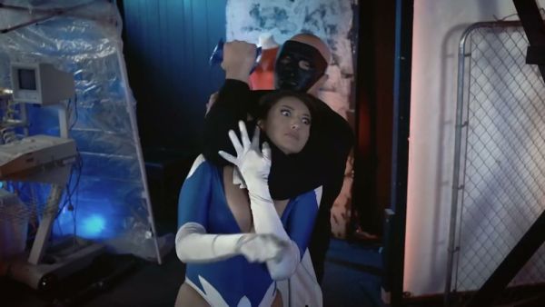 Brunette superheroine in blue mask stripped down under surveillance on breastful.com