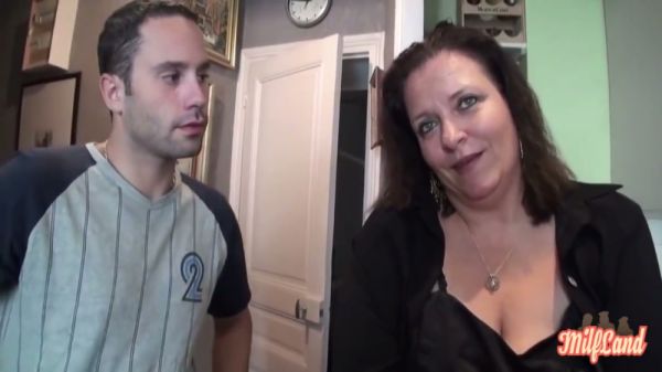 Mature full-figured MILF in black lingerie rides her lover on a dark bed on breastful.com