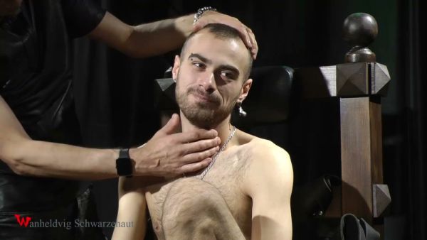 Submissive man masked and electrified on a bondage chair on breastful.com