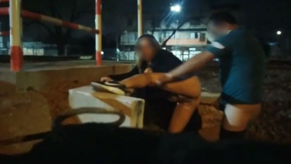 Blonde Argentinian woman exposes herself barefoot on city streets under streetlights - Argentina on breastful.com