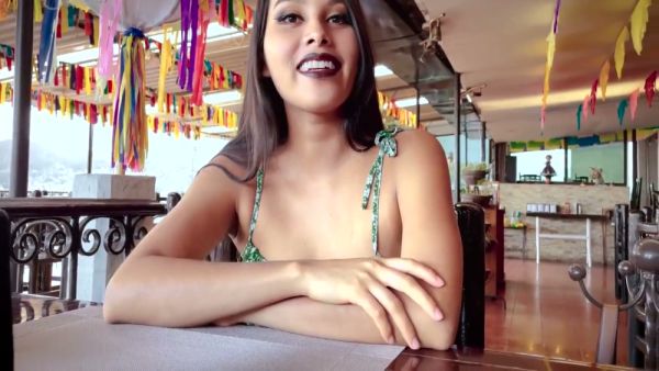 Young Mexican woman explores herself in green floral dress across terrace and couch - Mexico on breastful.com