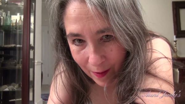 Mature gray-haired woman Grace proudly displays her natural hairy pussy in intimate solo scenes at home on breastful.com