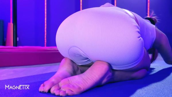 Fitness babe blends yoga poses with intimate self-touch on a purple mat on breastful.com