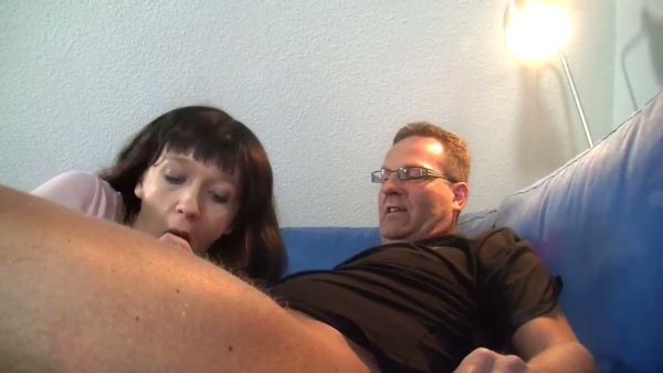 Brunette performs intense blowjob and rides partner on living room sofa on breastful.com