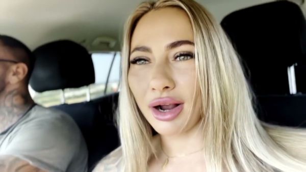 Tattooed blonde moves from car seat to grass for intense oral and handjob on breastful.com