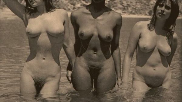 Vintage trio of hairy interracial lesbians pose nude at the beach on breastful.com