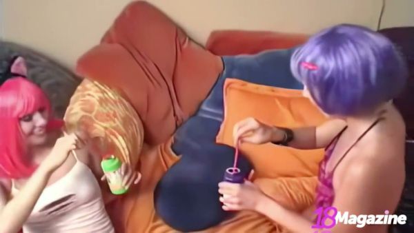 Pink-haired Candie and purple-haired Crush share intimate moments in a playful lesbian encounter on breastful.com