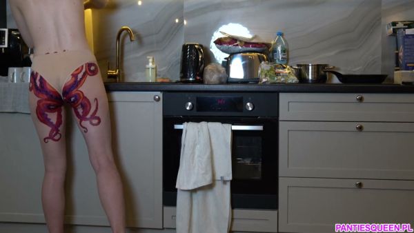 Nude American housewife with octopus tattoo cooks dinner in modern kitchen - Germany - Usa on breastful.com