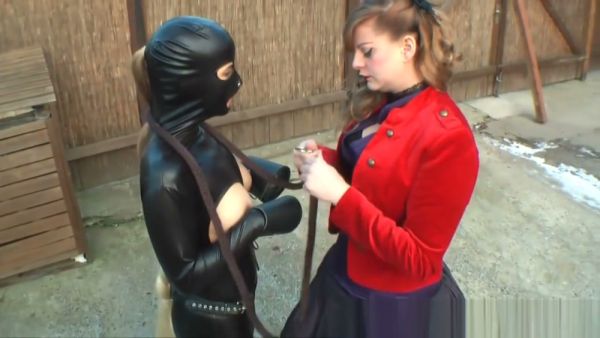 Lady Grace commands her pony in a snowy backyard and dim dungeon on breastful.com