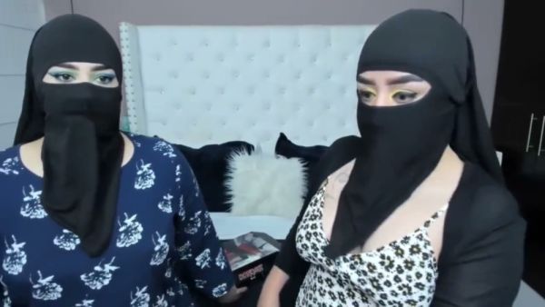 Two masked Arab women share an intimate lesbian cam session on breastful.com