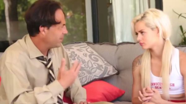 Petite blonde in pigtails shares passionate outdoor moments on a striped couch on breastful.com