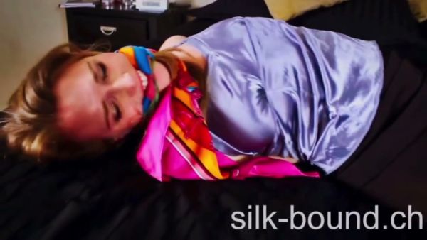 Blonde woman bound and gagged in intense BDSM session on breastful.com