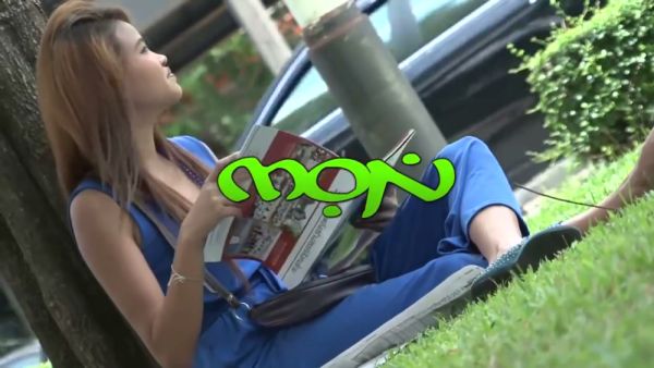 Thai woman with smooth legs straddles a tattooed white man on a beige couch - Thailand on breastful.com