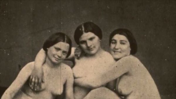 Three hairy lesbians in vintage poses share intimate moments in sepia tones on breastful.com