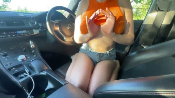 Skinny brunette with big natural tits gives head in a car after flashing her midriff on breastful.com