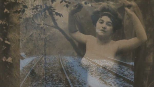 Curated vintage erotica unfolds along a snow-covered railway in moody archival stills on breastful.com