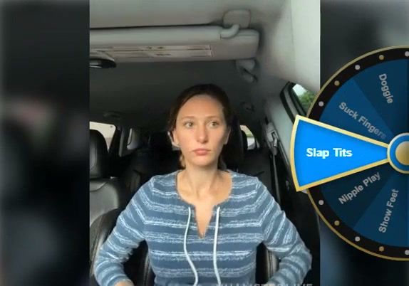 Woman spreads herself open in the front seat of a car on breastful.com