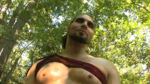 Blonde dominatrix binds and controls her muscular captive in a sunlit forest ritual on breastful.com