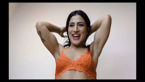 Amateur Latina in orange lace bra flaunts her big ass and tits on the couch on breastful.com