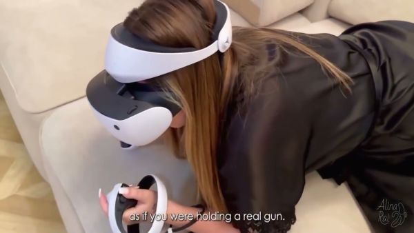 Woman in VR headset gets intimate with another woman in living room on breastful.com