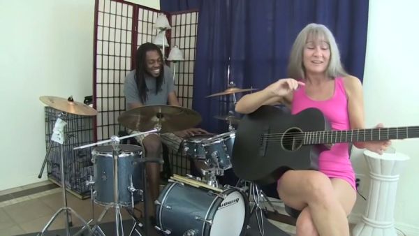 Blonde woman with gray hair takes black musician deep in throat and bed on breastful.com