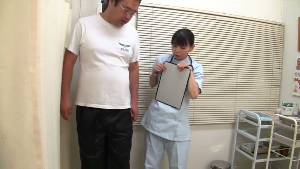 Young Asian nurse performs intimate exam on male patient in clinic on breastful.com