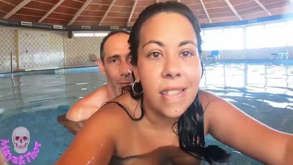 Voluptuous brunette MILF caught in steamy indoor pool encounter with multiple lovers on breastful.com