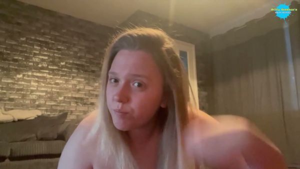 Young blonde solo star teases bare breasts in warm brick-lit room on breastful.com