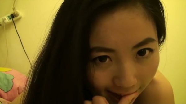 Taiwanese girl Lin Xiaoxia explores her body in private on a dimly lit bed on breastful.com