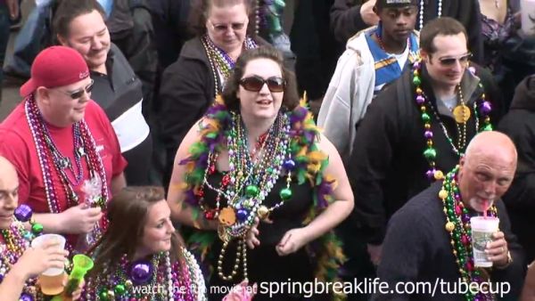 MILF flashes her large breasts during Mardi Gras street celebration on breastful.com