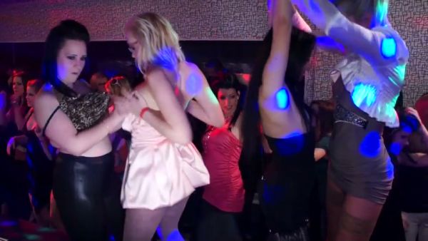 Young adults let loose in a neon-lit club during an impromptu group encounter on breastful.com