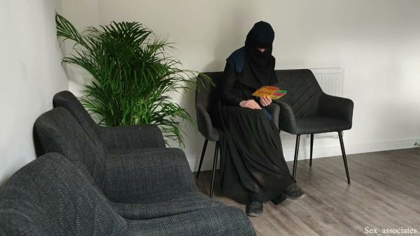 Receptionist in white apron bends over armchair after catching a patient flashing in the clinic office - Usa on breastful.com