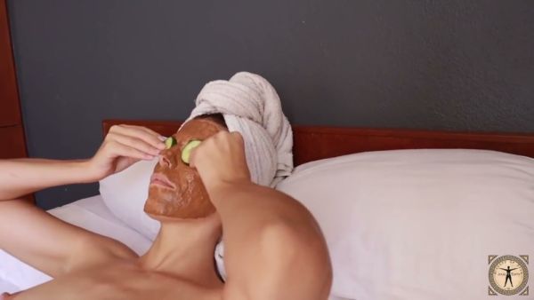 Brunette with small breasts and thick thighs enjoys a private spa moment with facial mask and cucumbers on breastful.com