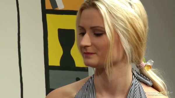 Blonde locks tangled in the cushions as the couple sinks into the couch on breastful.com