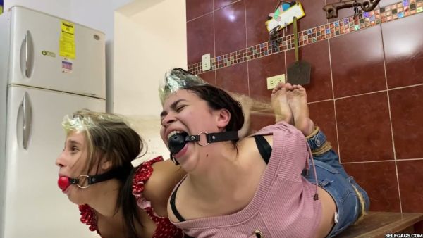 Two bound and gagged women restrained in tight rope bondage on wooden tables - Spain on breastful.com