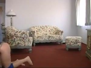 Pony girl lifted onto the floral sofa during a BDSM session on breastful.com
