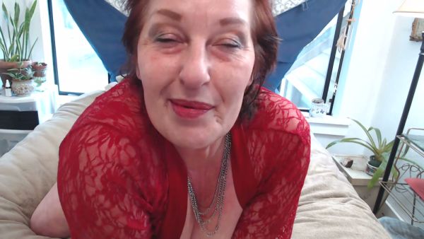 Mature redhead woman embraces her natural curves in intimate solo scenes on breastful.com