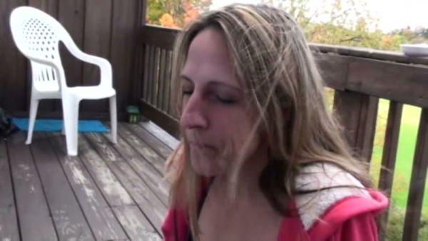 Woman gives deep throat blowjob to man on wooden deck outdoors on breastful.com