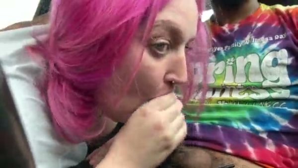 Pink-haired woman gives intense car blowjob to black man on break on breastful.com